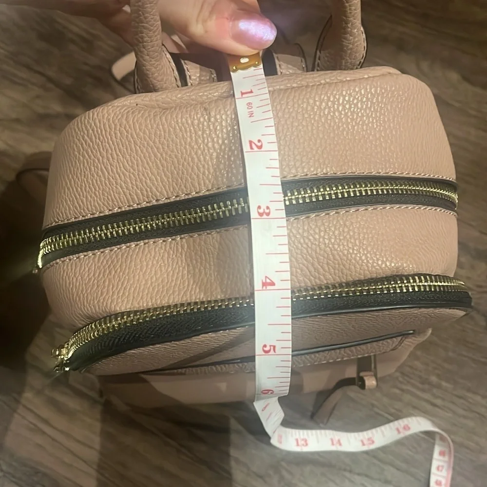 small pink faux leather backpack